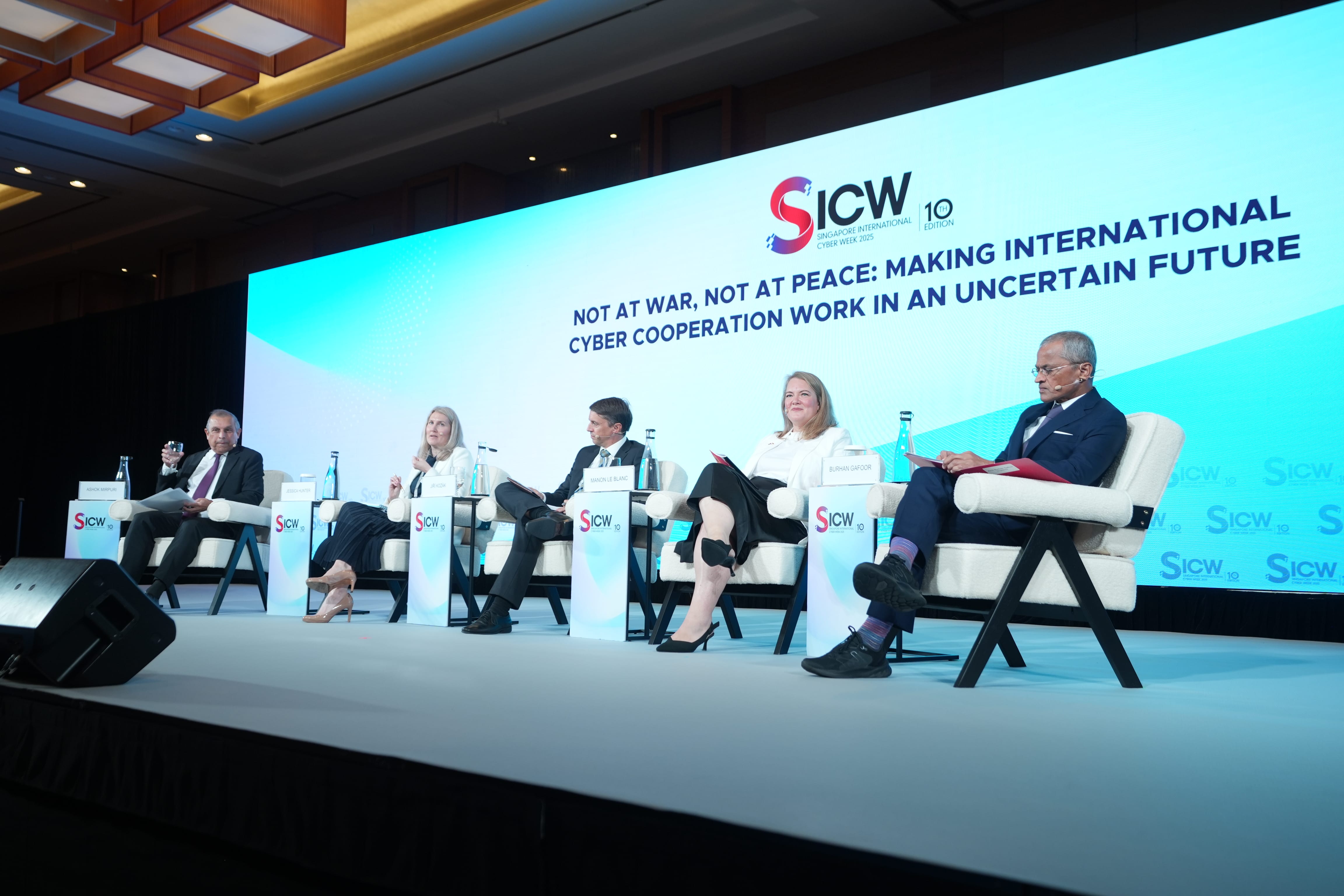Image of speakers at a previous SICW plenary